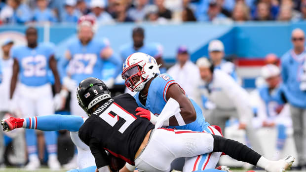 Oct 29, 2023; Nashville, Tennessee, USA; Tennessee Titans linebacker Azeez Al-Shaair (2) sacks Atlanta Falcons quarterback Desmond Ridder (9) during the first half at Nissan Stadium. Mandatory Credit: Steve Roberts-USA TODAY Sports
